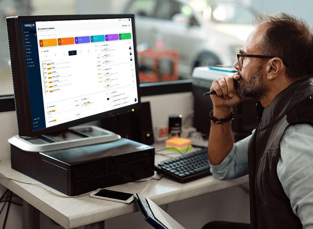 Garage owner using Autopilot GMS dashboard to manage jobs, bookings and invoices